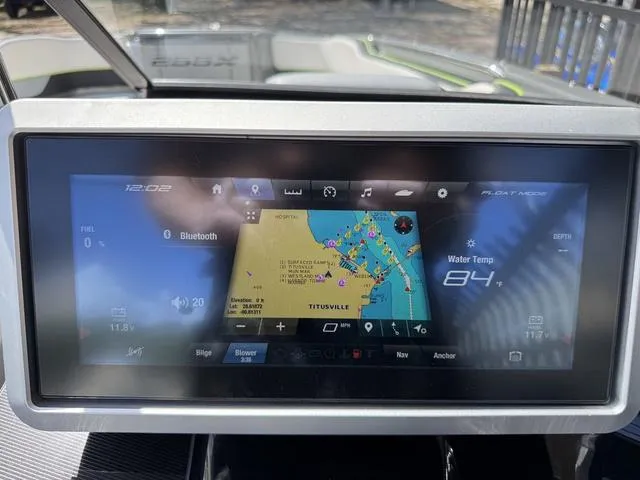 Slide: The Image of Dashboard of 2021 Yamaha Boats 255XD showing navigation and water temperature. - 19