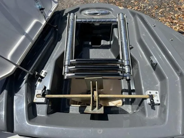 Slide: The Image of Yamaha Boats 2021 255XD ladder compartment, open with metal ladder visible. - 27