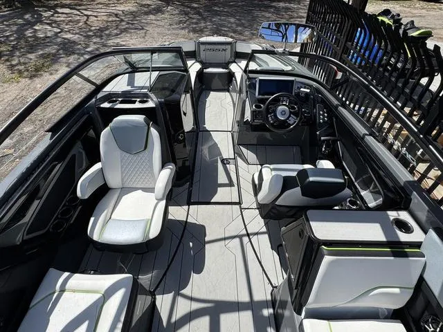 Slide: The Image of 2021 Yamaha Boats 255XD interior with modern seating and sleek dashboard design. - 7