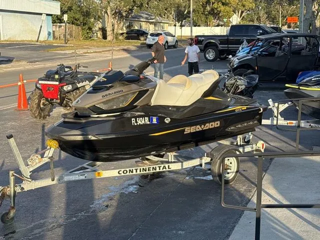 Slide: The Image of 2017 Sea-Doo GTX Waverunner on trailer in parking lot, sunny day. - 4