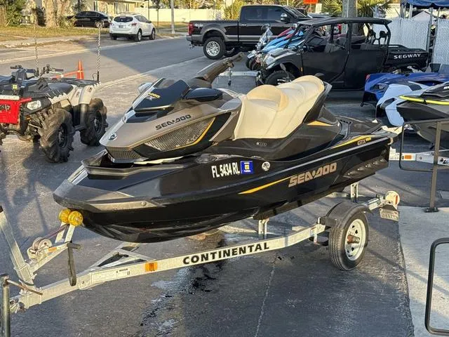 Slide: The Image of 2017 Sea-Doo GTX Waverunner on trailer, parked outdoors in a lot. - 6