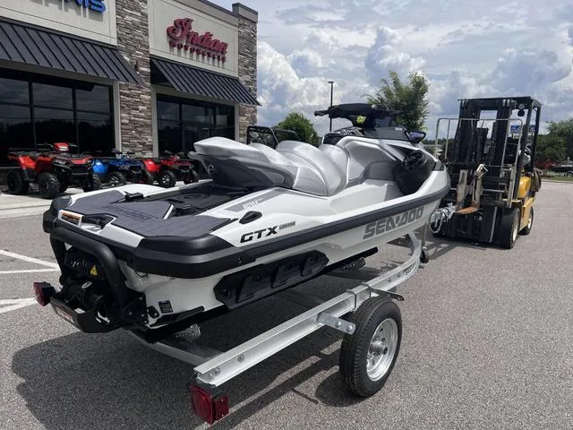 Slide: The Image of 2025 Sea-Doo GTX LTD 325 Waverunner on trailer outside dealership. - 4