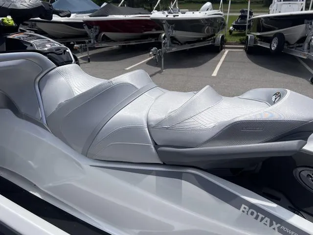 Slide: The Image of 2025 Sea-Doo Waverunner GTX LTD 325 with sound system, sleek silver design, parked outdoors. - 8