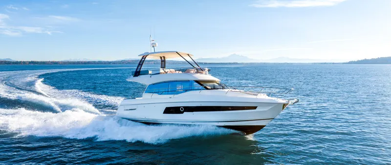 The Image of 2024 Prestige 460 Fly yacht cruising on open water. - 1
