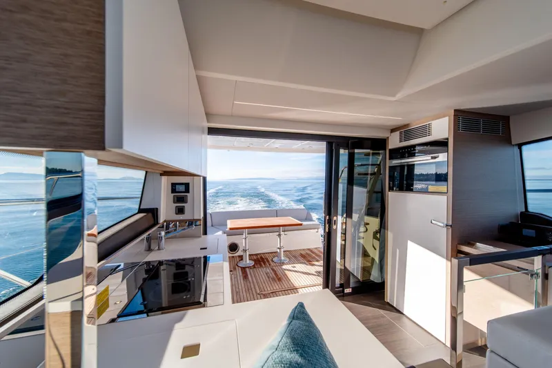 Slide: The Image of Luxurious interior of 2024 Prestige 460 Fly yacht with modern kitchen and ocean view. - 3