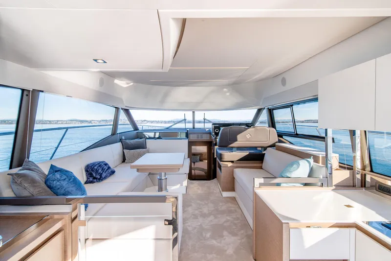 Slide: The Image of Luxurious interior of 2024 Prestige 460 Fly yacht with modern seating and panoramic views. - 6