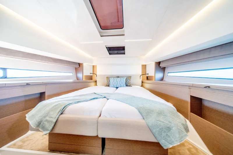 Slide: The Image of Luxurious bedroom interior of 2024 Prestige 460 Fly yacht, featuring modern design and cozy bedding. - 9