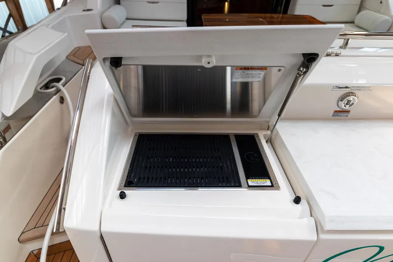 Slide: The Image of Outdoor grill on 2023 Tiara Yachts C44 Coupe, showcasing sleek design and functionality. - 11