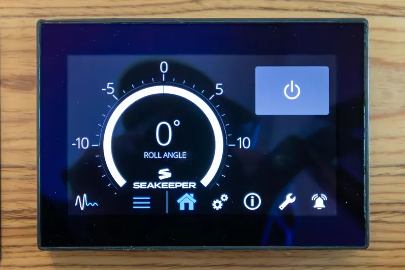 Slide: The Image of Digital control panel of 2023 Tiara Yachts C44 Coupe displaying Seakeeper roll angle. - 28