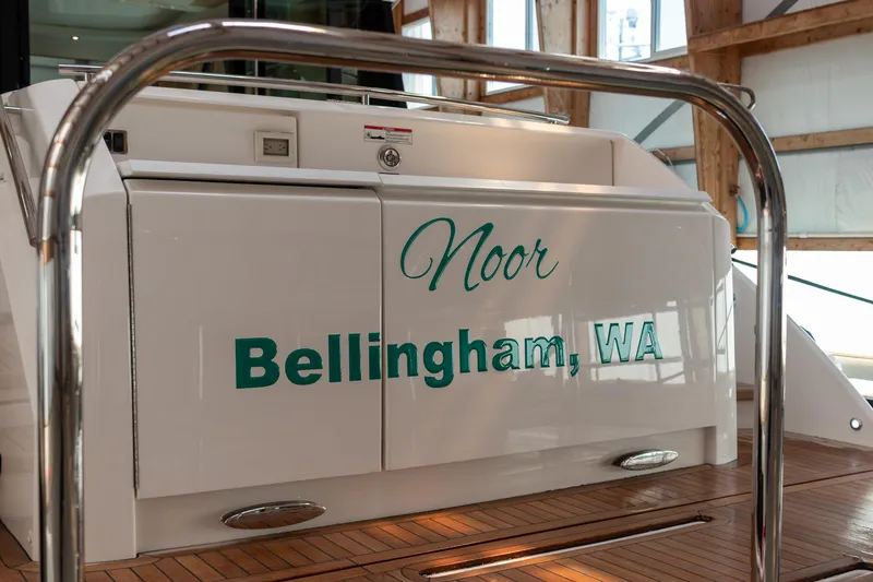 Slide: The Image of 2023 Tiara Yachts C44 Coupe with "Noor" and "Bellingham, WA" on the stern. - 7