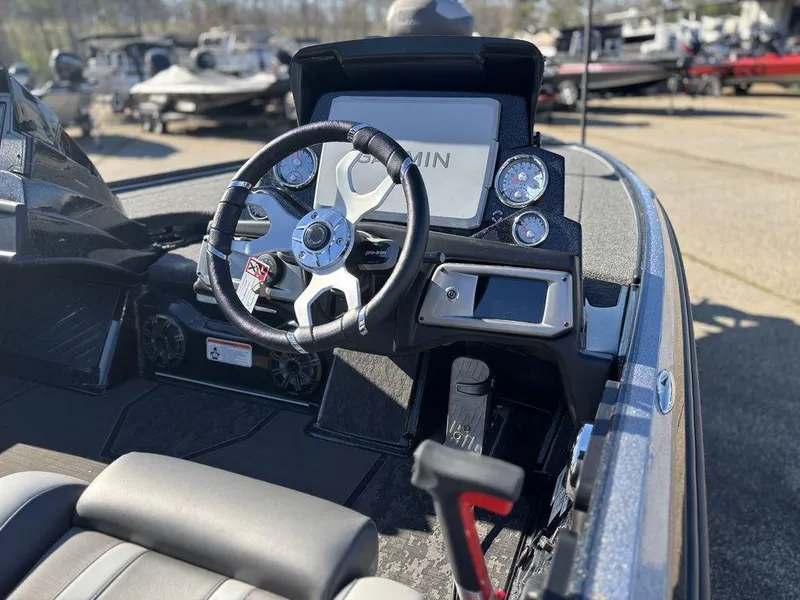 Slide: The Image of 2025 Nitro Z20 XL Pro boat dashboard with steering wheel and control panel. - 11