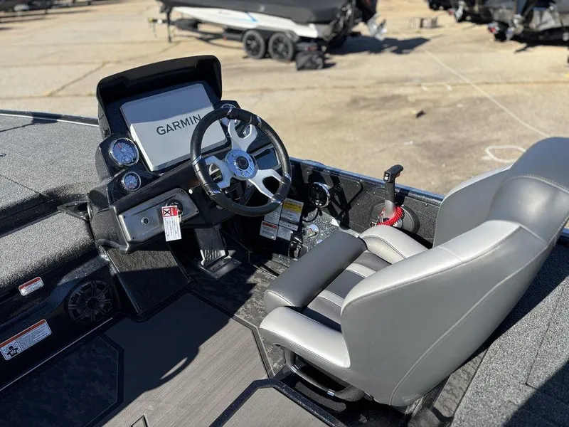 Slide: The Image of 2025 Nitro Z20 XL Pro boat cockpit with Garmin display and steering wheel. - 13