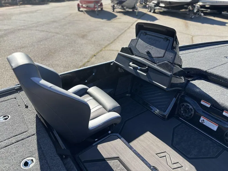 Slide: The Image of 2025 Nitro Z20 XL Pro boat interior with seat and dashboard in a sunny outdoor setting. - 15