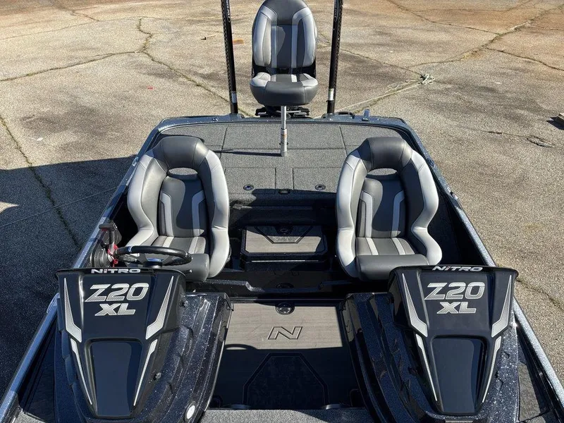 Slide: The Image of 2025 Nitro Z20 XL Pro boat interior with dual seats and steering console. - 21