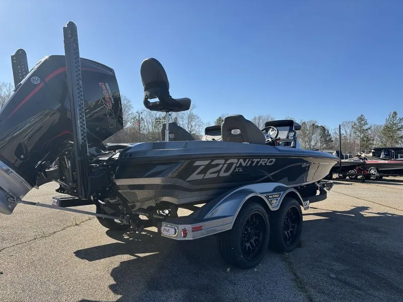 Slide: The Image of 2025 Nitro Z20 XL Pro boat with dual axles and powerful outboard motor. - 5