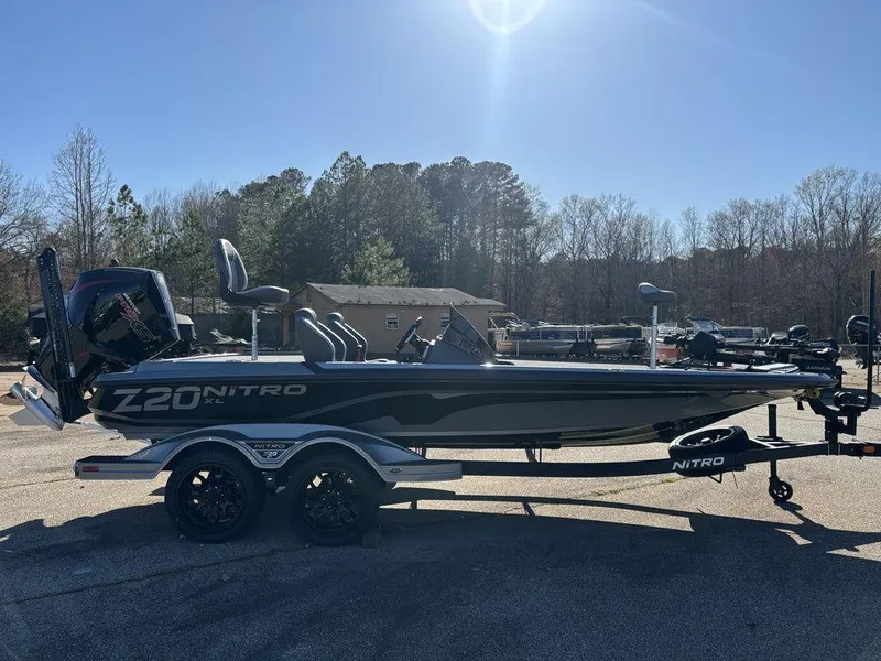 Slide: The Image of 2025 Nitro Z20 XL Pro boat on trailer, parked outdoors under clear sky. - 6