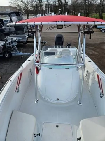 Slide: The Image of 2005 Baja 250 Sportfish Center Console with red canopy, docked outdoors. - 14