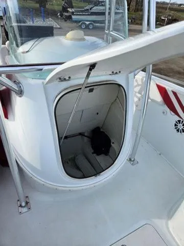 Slide: The Image of 2005 Baja 250 Sportfish Center Console with open storage compartment on deck. - 15