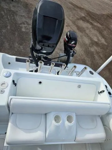 Slide: The Image of 2005 Baja 250 Sportfish Center Console with outboard motor and rod holders. - 18