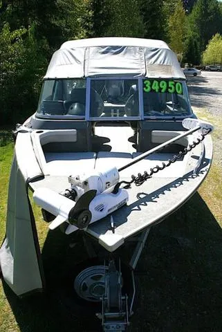 Slide: The Image of 2012 Alumacraft Trophy 205 Sport boat with canopy, displayed outdoors, price tag $34,950. - 14