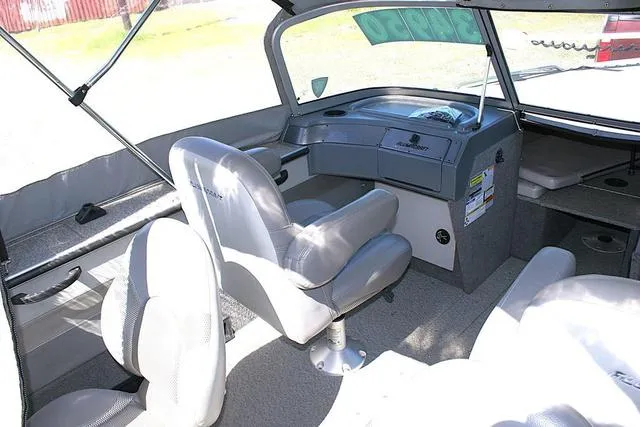 Slide: The Image of Interior of a 2012 Alumacraft Trophy 205 Sport boat with seating and dashboard. - 7