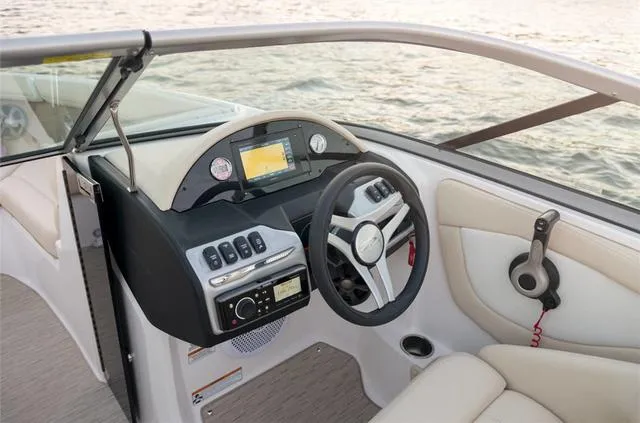 Slide: The Image of Storage compartment in 2020 Regal 21 OBX boat with life jacket and colorful towels. - 12