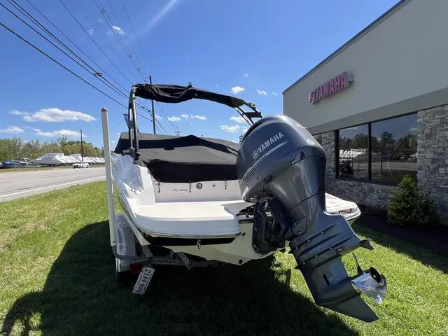 Slide: The Image of 2020 Regal 21 OBX boat on trailer at Hughes Marine dealership. - 18