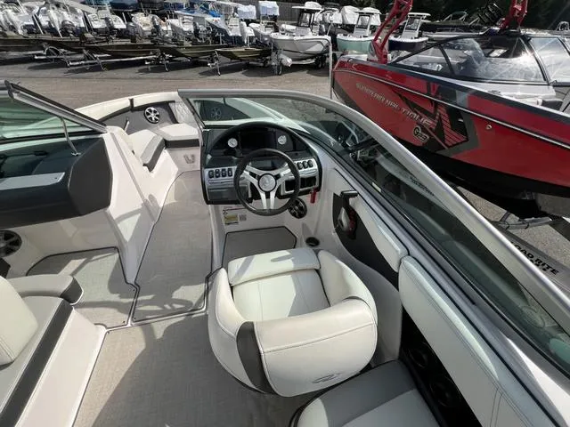 Slide: The Image of 2020 Regal 21 OBX boat with Yamaha outboard motor, parked outside dealership. - 20