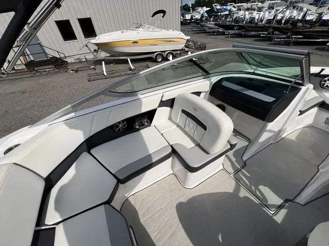 Slide: The Image of 2020 Regal 21 OBX boat interior with white seating and modern design. - 21