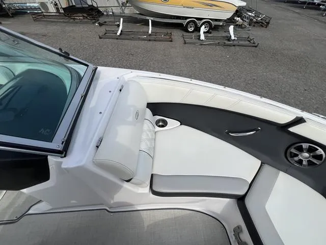 Slide: The Image of 2020 Regal 21 OBX boat interior with white seating and cup holder. - 26