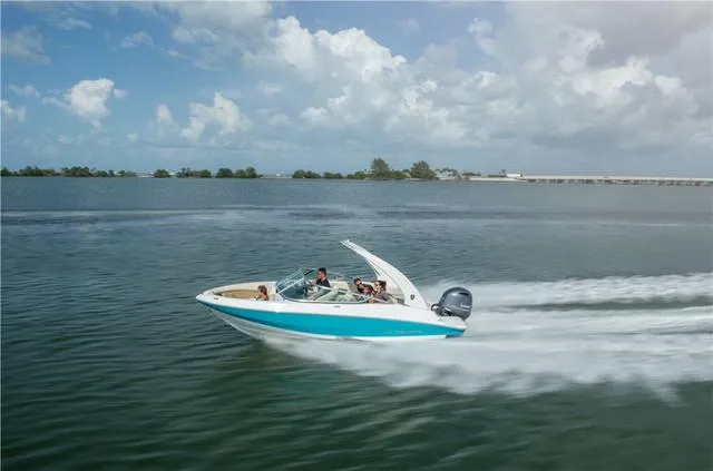 Slide: The Image of 2020 Regal 21 OBX boat on water with family enjoying beach in background. - 3