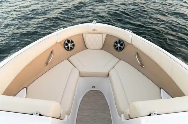 Slide: The Image of 2020 Regal 21 OBX boat on calm water under a clear sky. - 6