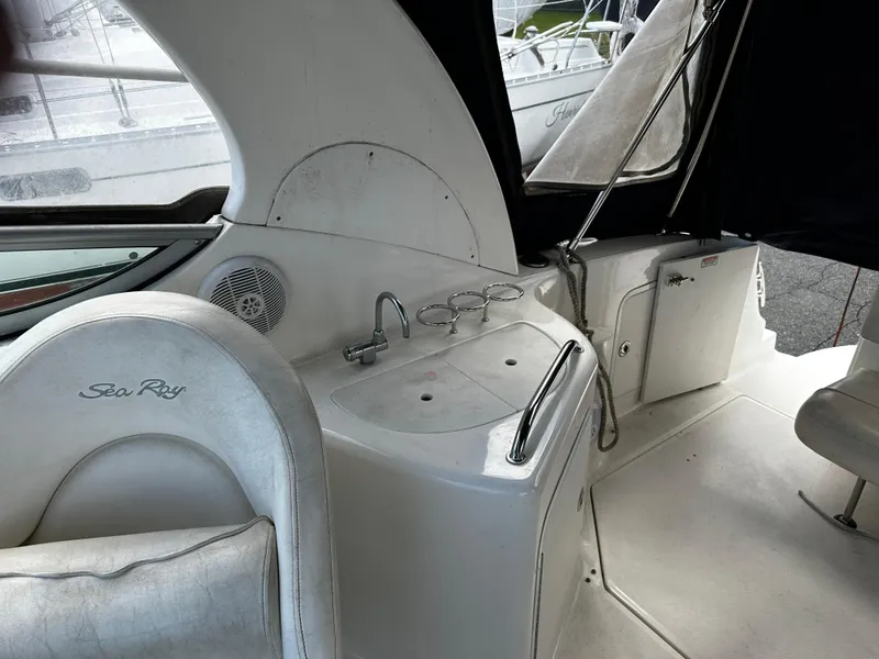 Slide: The Image of 2006 Sea Ray 280 Sundancer interior with sink and seating area. - 11