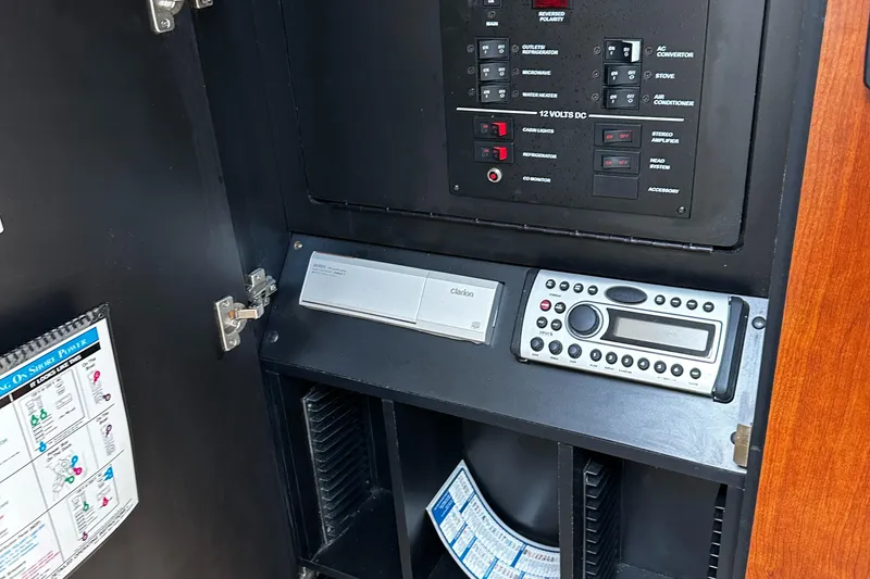 Slide: The Image of Control panel of a 2006 Sea Ray 280 Sundancer boat with electronic equipment. - 19