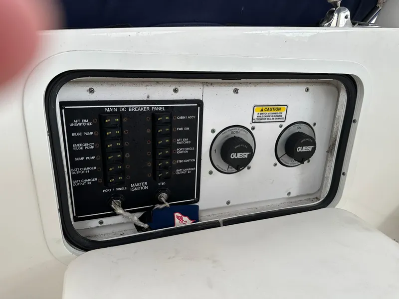 Slide: The Image of Control panel of a 2006 Sea Ray 280 Sundancer boat, featuring switches and dials. - 20