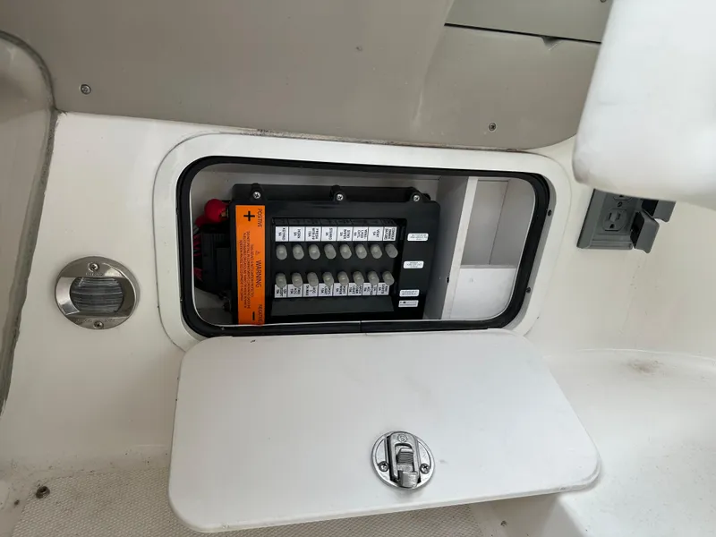 Slide: The Image of Electrical panel on a 2006 Sea Ray 280 Sundancer boat, open compartment view. - 21