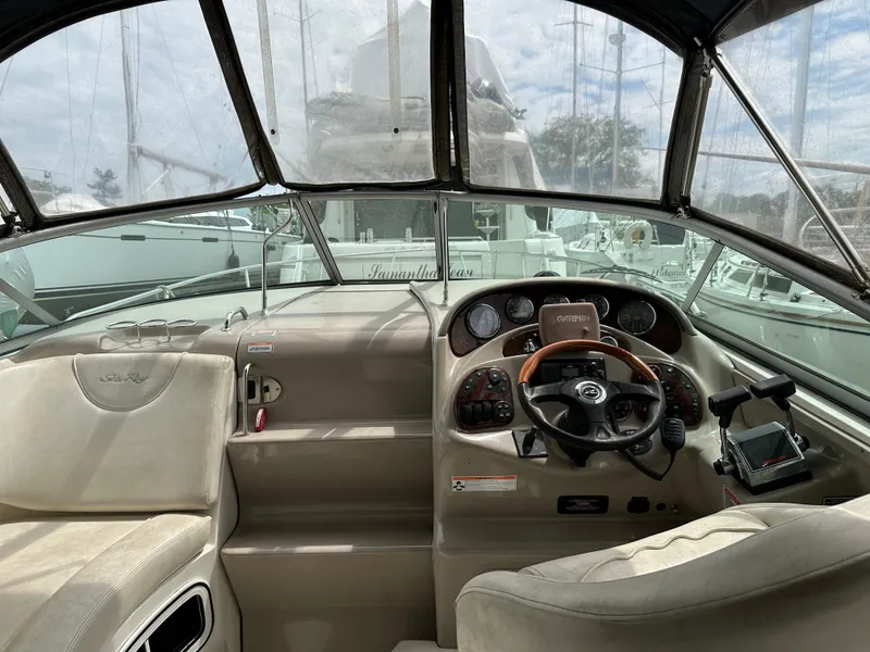 Slide: The Image of Interior view of 2006 Sea Ray 280 Sundancer boat cockpit with steering wheel and controls. - 5