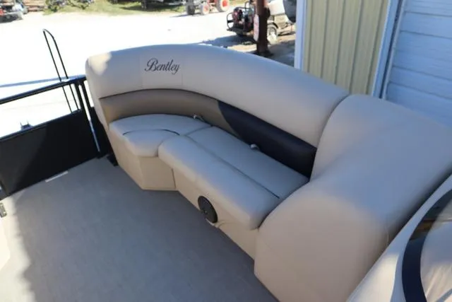 Slide: The Image of 2018 Bentley Pontoons Legacy 223 Cruise SE with beige seating and elegant design. - 5