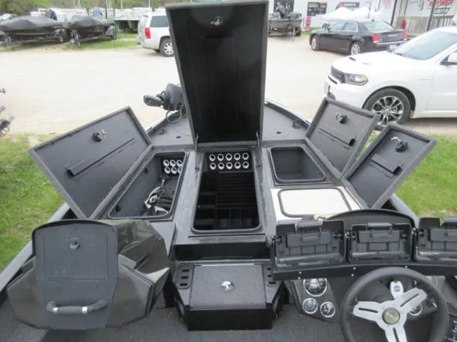 Slide: The Image of 2020 Vexus AVX1980 boat interior with open storage compartments and steering wheel. - 6