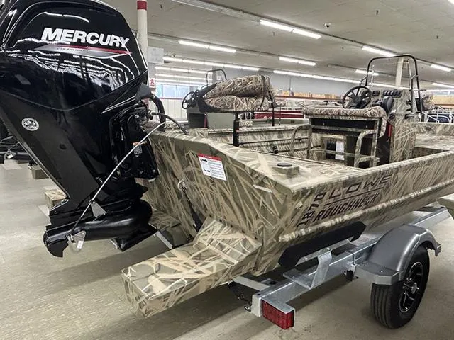 Slide: The Image of 2025 Lowe RX1870 Pathfinder boat with Mercury engine, camo design, displayed indoors. - 10