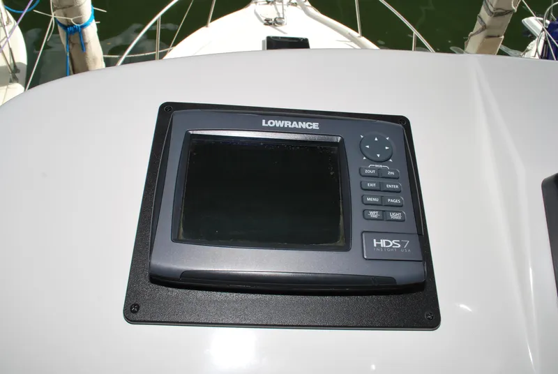 Slide: The Image of Lowrance HDS-7 marine display on 2005 Stamas 370 Express boat dashboard. - 12