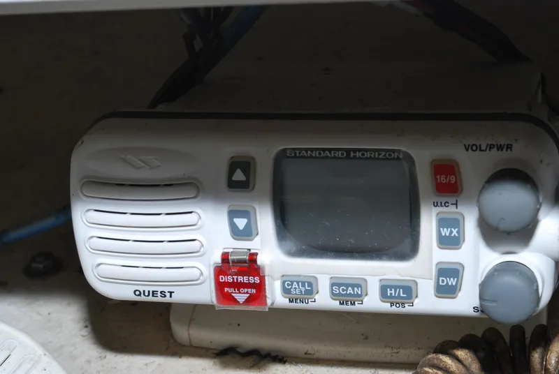 Slide: The Image of Standard Horizon marine radio on 2005 Stamas 370 Express boat, featuring distress button and controls. - 14