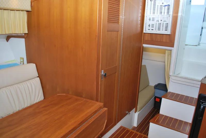 Slide: The Image of 2005 Stamas 370 Express cabin interior with wooden finishes and seating area. - 49