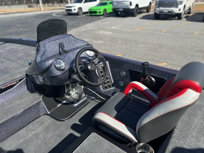 Slide: The Image of Interior of 2025 Phoenix 920 Elite boat with steering wheel and seat. - 11