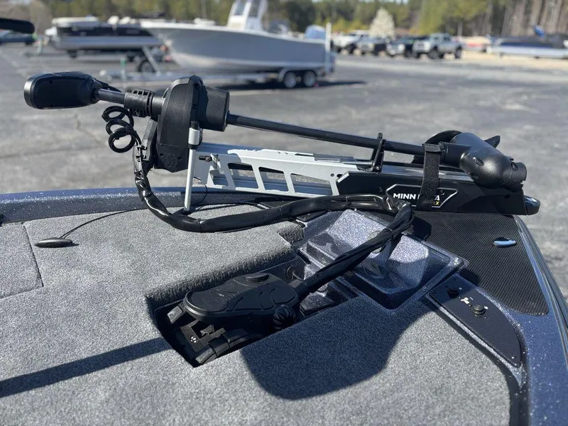 Slide: The Image of Trolling motor on Phoenix 920 Elite boat, 2025 model, in a parking lot setting. - 14