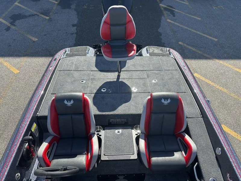 Slide: The Image of 2025 Phoenix 920 Elite boat interior with red and gray seating, top view. - 15
