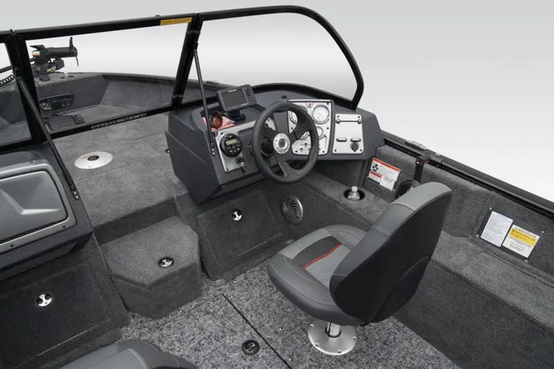 Slide: The Image of 2025 Tracker Pro Guide™ V-175 WT boat interior with steering wheel and seating. - 21