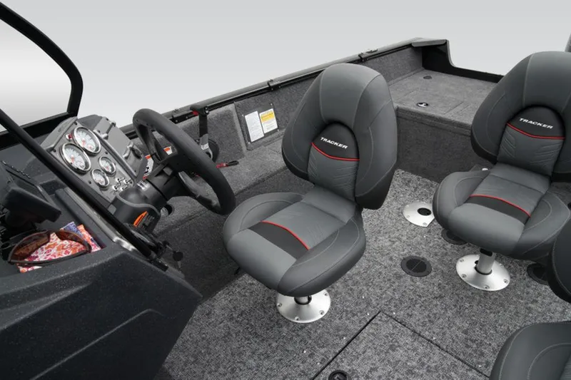 Slide: The Image of 2025 Tracker Pro Guide™ V-175 WT boat interior with gray seating and control panel. - 24