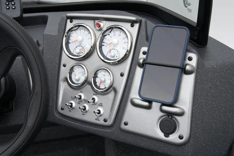 Slide: The Image of Dashboard of 2025 Tracker Pro Guide™ V-175 WT with gauges and smartphone holder. - 28