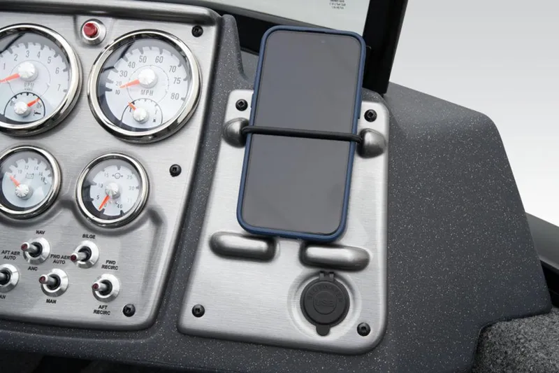 Slide: The Image of Dashboard of 2025 Tracker Pro Guide™ V-175 WT with gauges and phone holder. - 31